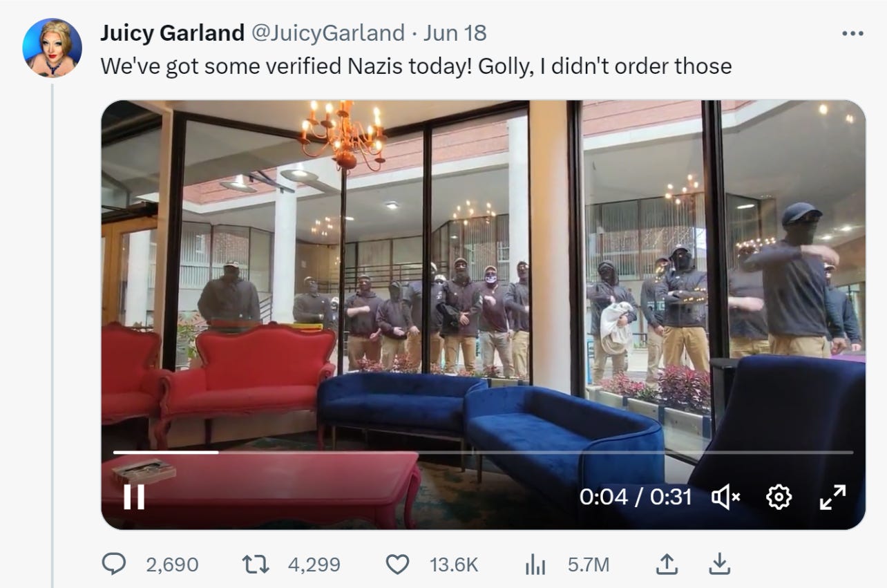 screenshot of tweet -- "we've got some verified nazis today" from drag queen juicy garland. Video embedded is below and shows a protest that looks very Nazi-esque.