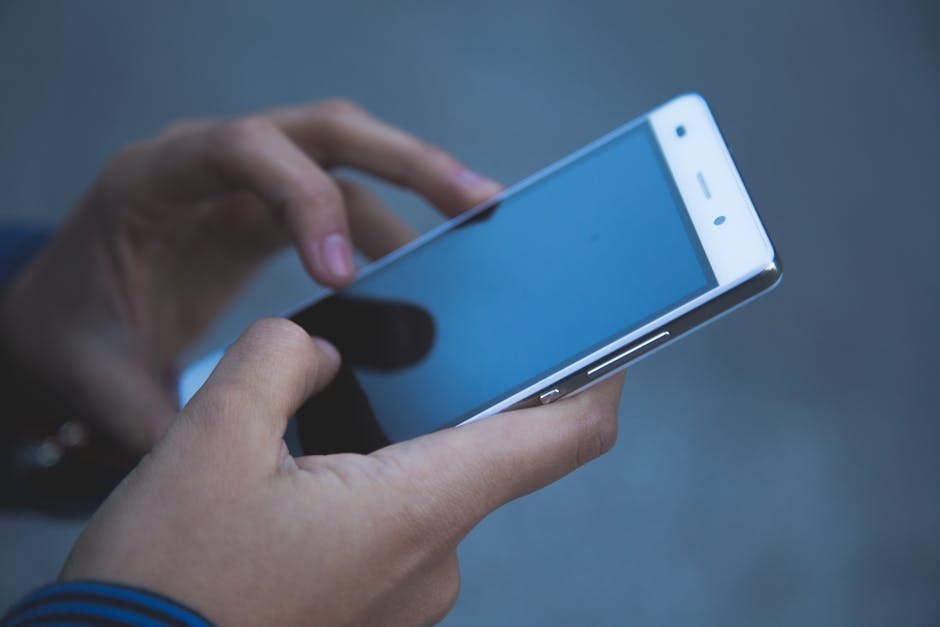 Person Holding White Smartphone · Free Stock Photo