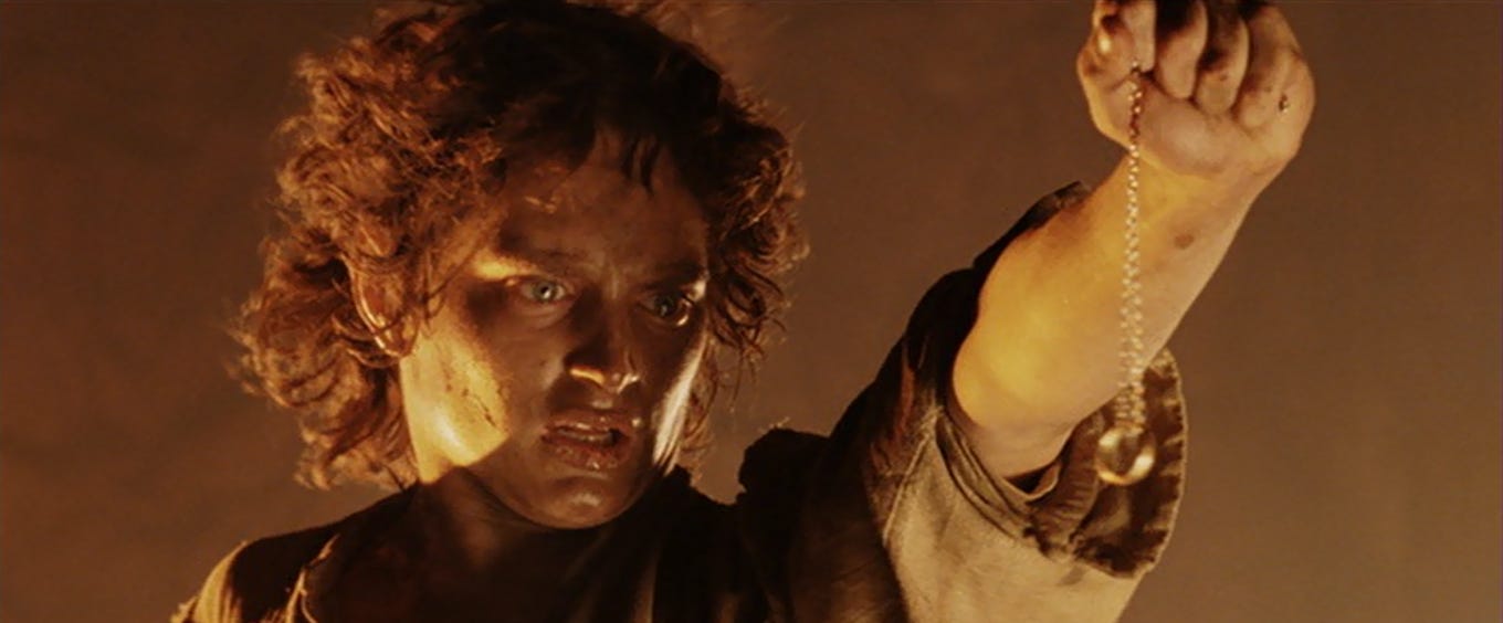 Frodo holding the Ring while in Mount Doom, from Peter Jackson's movie