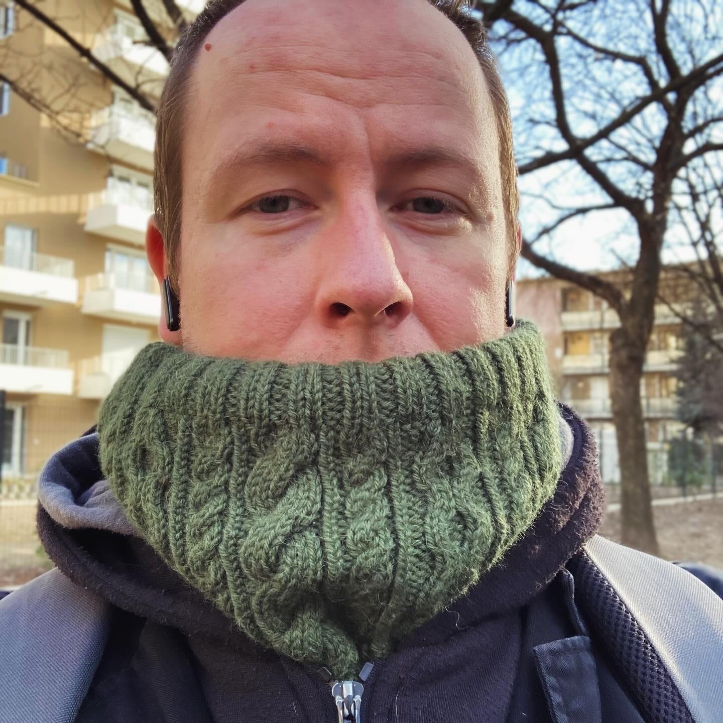 A selfie of Adam in the midst of February, wearing a hand-knit cowl pulled over his mouth to protect it from the cold.