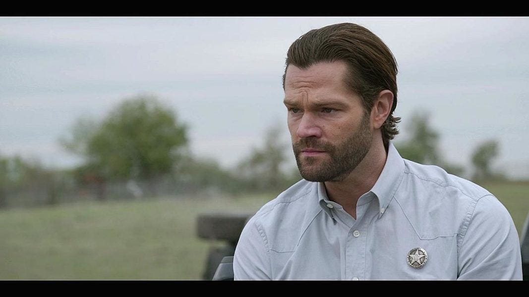 Jared Padalecki sitting on back of Ford truck on Walker set 3.11.