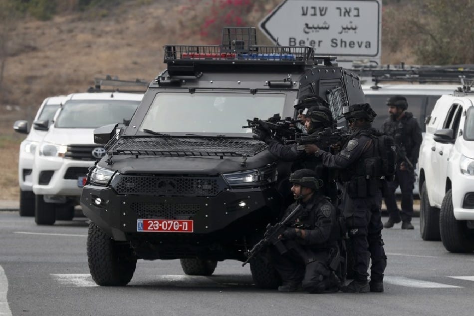 Israeli soldiers take position on the main road near the border with Gaza, October 8, 2023. Israel announced initiating a large-scale operation 'Swords of Iron' after surprise attacks on Israel on October 7 claimed by the Islamist movement Hamas killed more than 670 Israelis and left over 2,100 injured in the attacks, the Israeli army said October 8. EPA-EFE/ATEF SAFADI