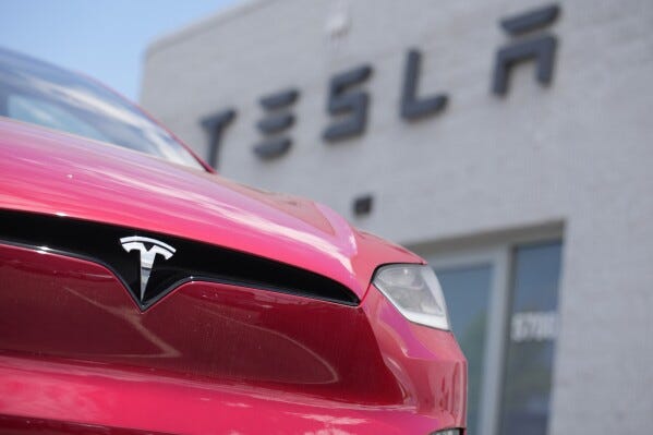 File - An unsold 2023 Model X sports-utility vehicle sits outside a Tesla dealership June 18, 2023, in Littleton, Colo. Tesla is recalling more than 2 million vehicles across its model lineup to fix a defective system that's supposed to ensure drivers are paying attention when they use Autopilot. (AP Photo/David Zalubowski, File)