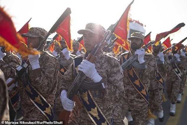 Islamic Revolutionary Guard Corps troops march in a military parade commemorating the anniversary of the Iran-Iraq War