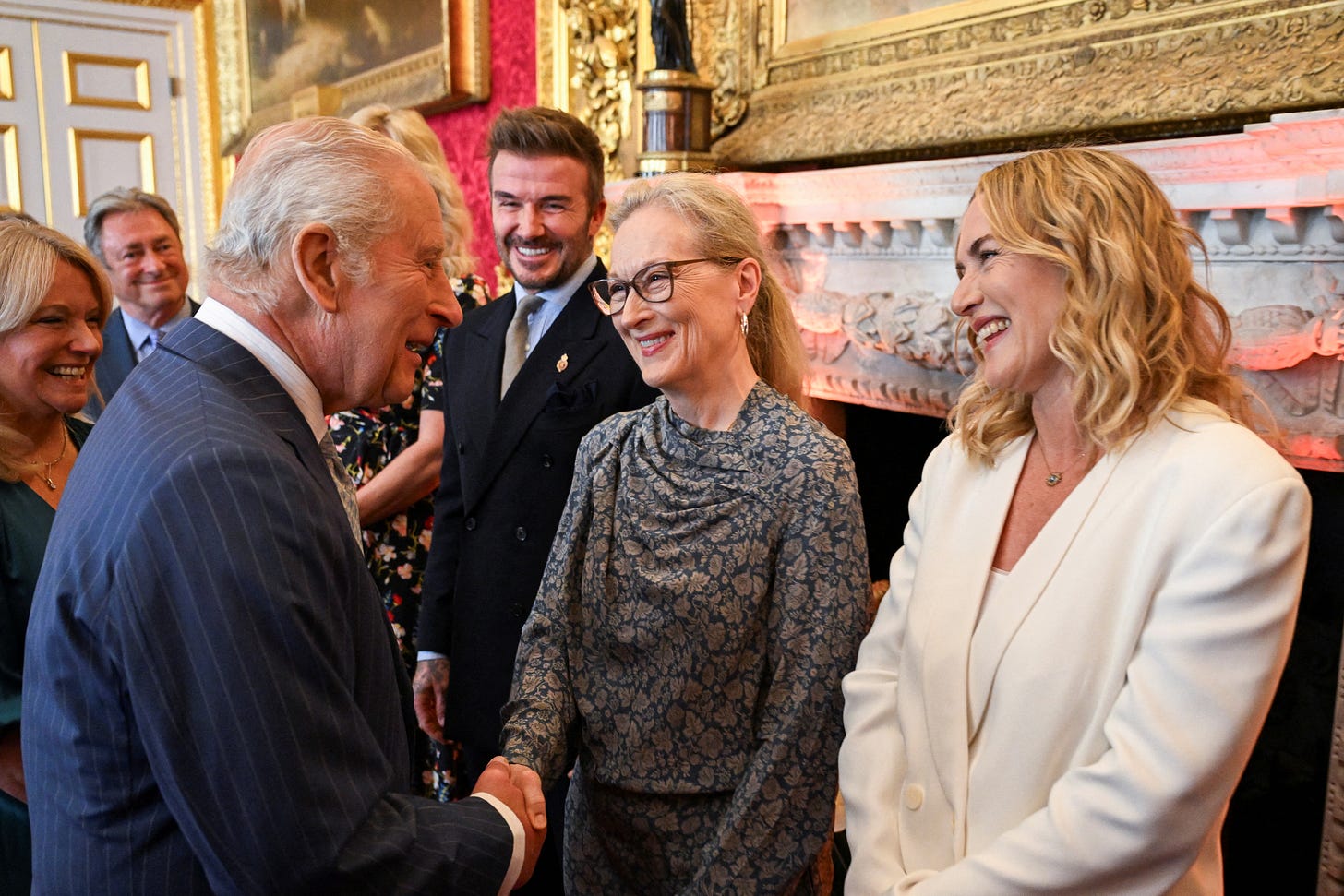 King Charles talking to David Beckham, Meryl Streep and Kate Winslet
