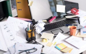 A cluttered desk (Allwork.Space)