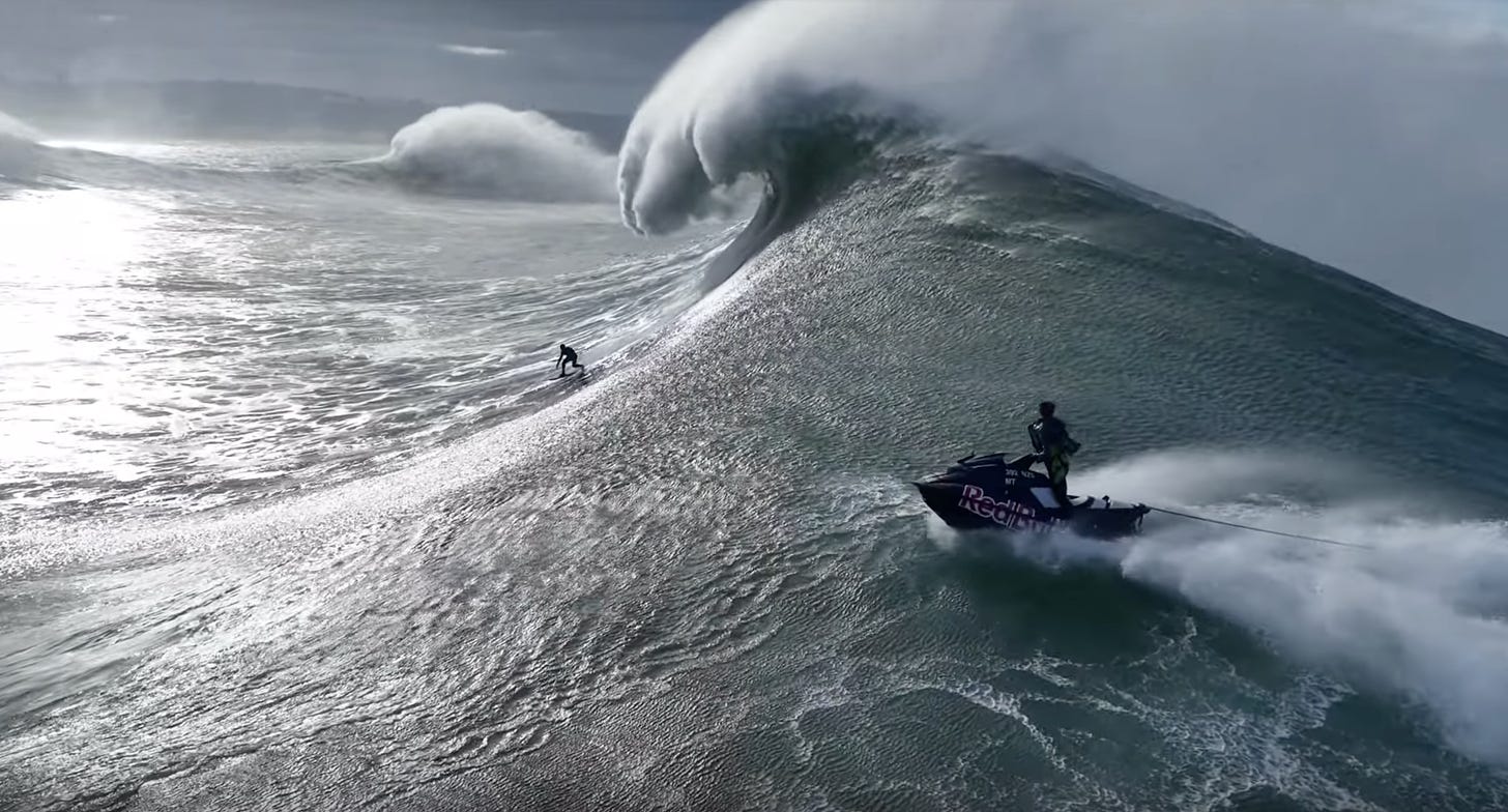 Drone video captures surfers braving liquid mountains at Nazaré