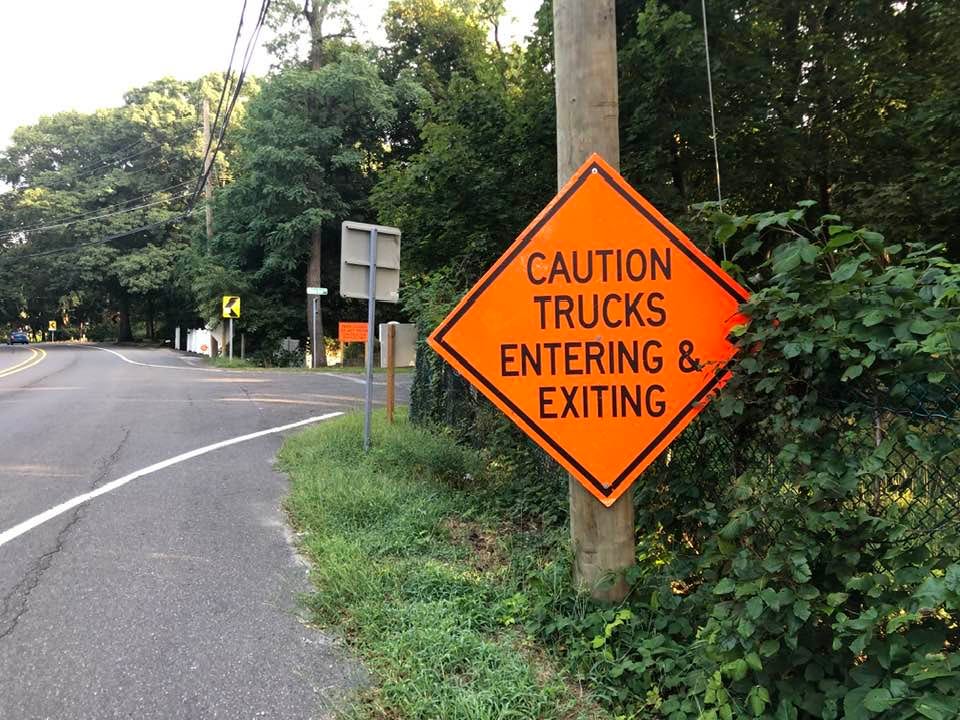 May be an image of road and text that says 'CAUTION TRUCKS ENTERING EXITING'