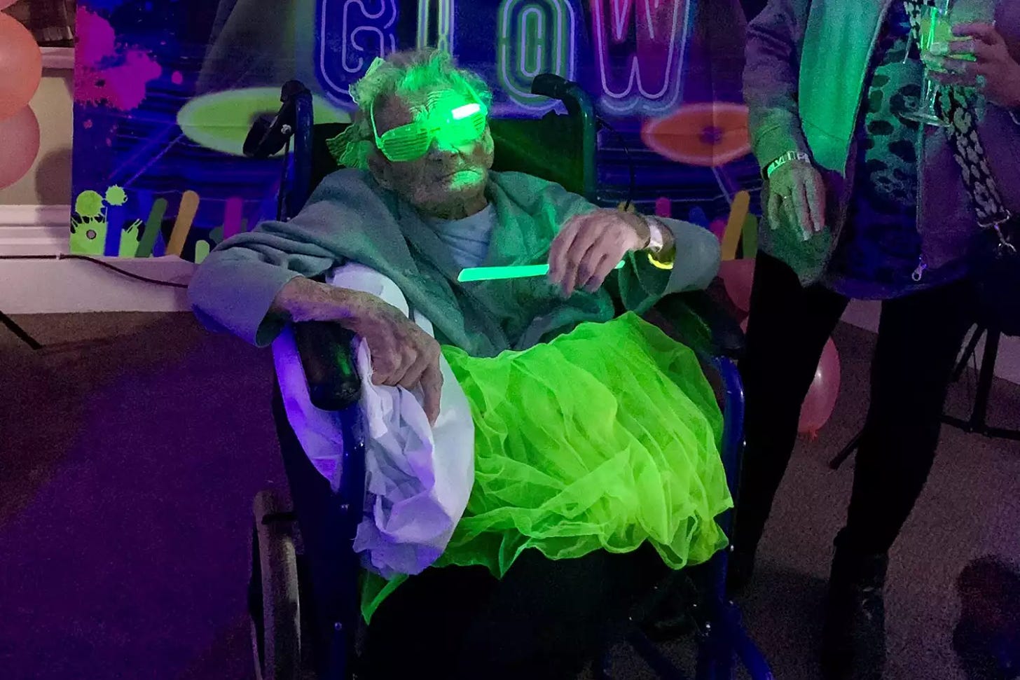 Vera Sak, who turned 103, celebrated her milestone birthday by wearing neon green glasses and rave-inspired garments to her party a Chestnuts Residential Home in Grimsby.