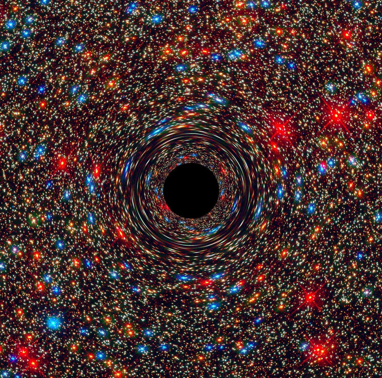 This computer-simulated image shows a supermassive black hole at the core of a galaxy. The black region in the center represents the black hole’s event horizon, where no light can escape the massive object’s gravitational grip. The black hole’s powerful gravity distorts space around it like a funhouse mirror. Light from background stars is stretched and smeared as the stars skim by the black hole.

Credits: NASA, ESA, and D. Coe, J. Anderson, and R. van der Marel (STScI)

More info: Astronomers have uncovered a near-record breaking supermassive black hole, weighing 17 billion suns, in an unlikely place: in the center of a galaxy in a sparsely populated area of the universe. The observations, made by NASA’s Hubble Space Telescope and the Gemini Telescope in Hawaii, may indicate that these monster objects may be more common than once thought.

Until now, the biggest supermassive black holes – those roughly 10 billion times the mass of our sun – have been found at the cores of very large galaxies in regions of the universe packed with other large galaxies. In fact, the current record holder tips the scale at 21 billion suns and resides in the crowded Coma galaxy cluster that consists of over 1,000 galaxies.