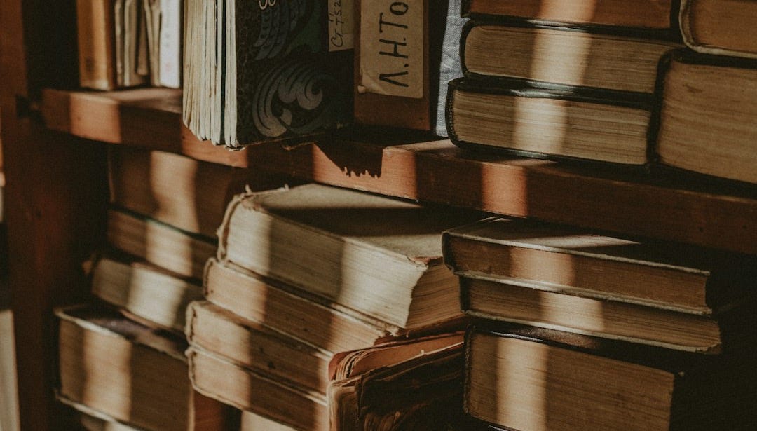 A book shelf filled with lots of books A book shelf filled with lots of books