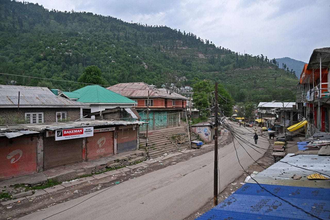 A man walks through a deserted street near the Line of Control border dividing Kashmir near Srinagar, India, on May 9.