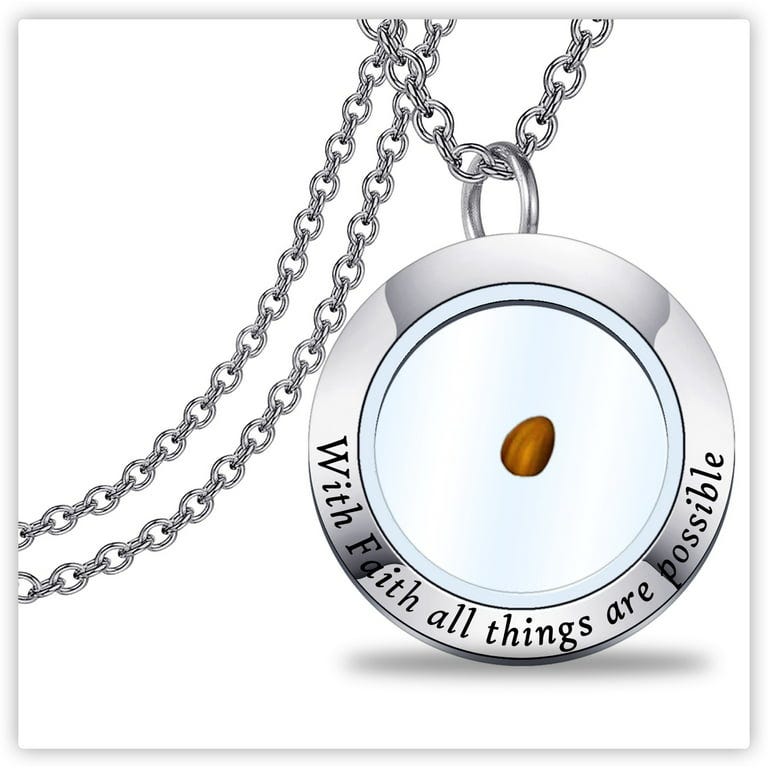 A silver necklace pendant with a mustard seed in the center. The pendant reads, "With faith all things are possible" along the edge.