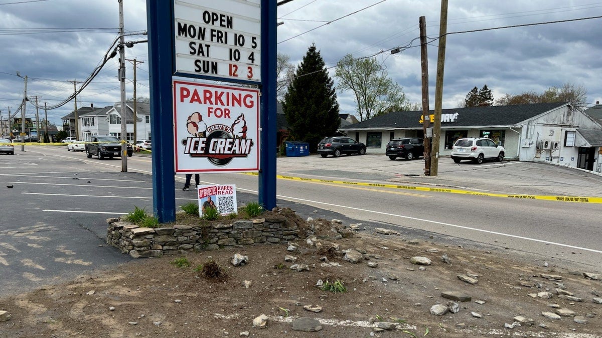 Debris near sign in ice cream parlor's parking lot