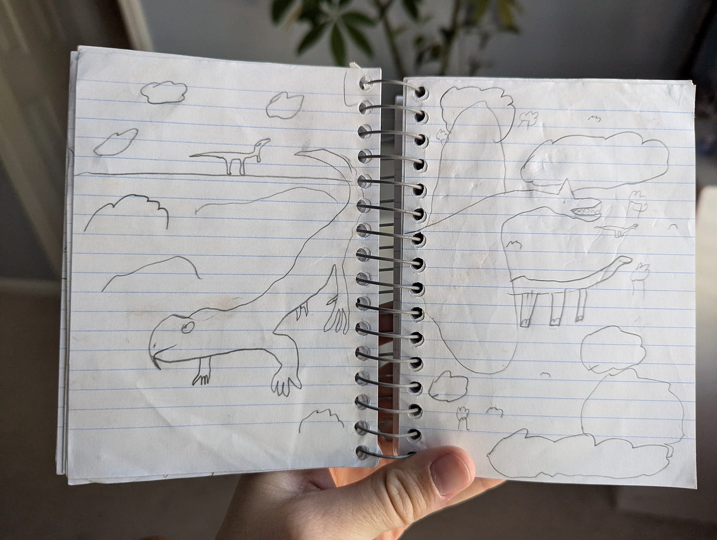Childhood sketches of ancient dinosaurs, plants, and other creatures.