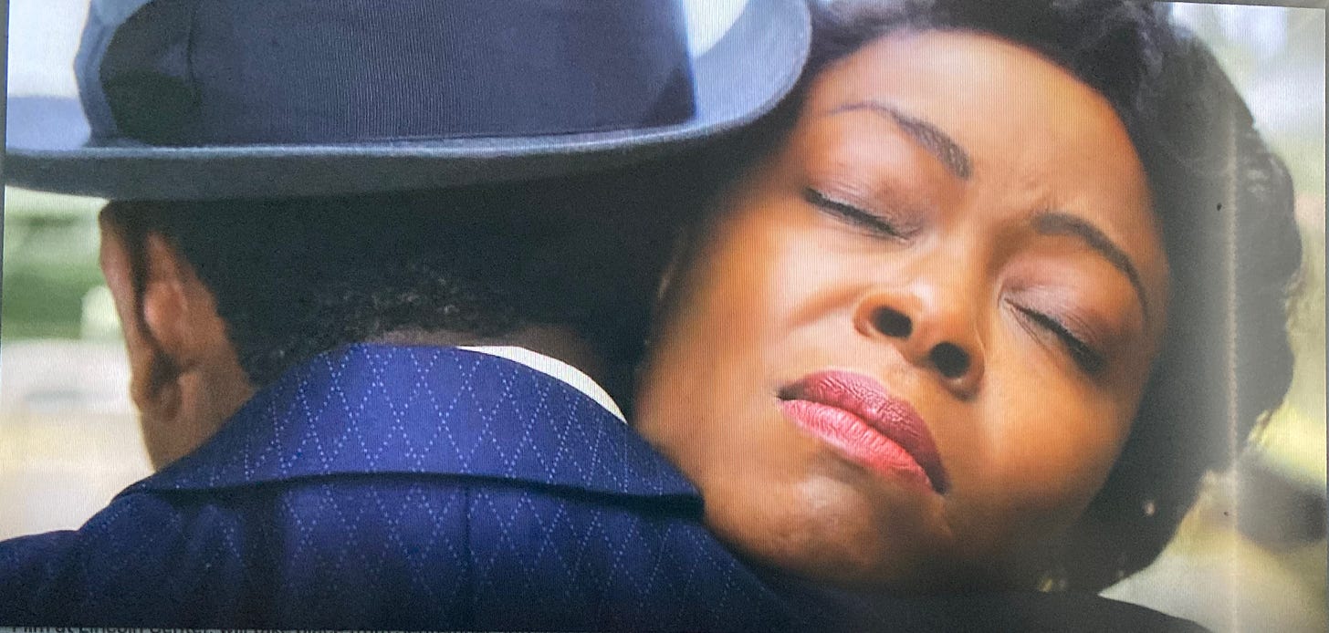 Screenshot from the movie 'Till' shows Danielle Deadwyler as Mamie Till-Mobley with eyes closed as she hugs her son Emmett Till for the last time.
