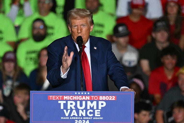 Donald Trump gestures while speaking at a campaign event