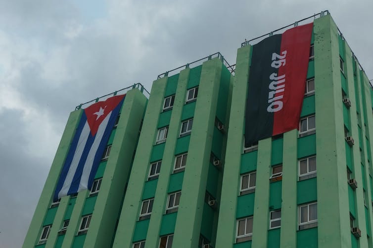 The 26 July Movement flag flying on a building in on building in Santa Clara, Cuba.