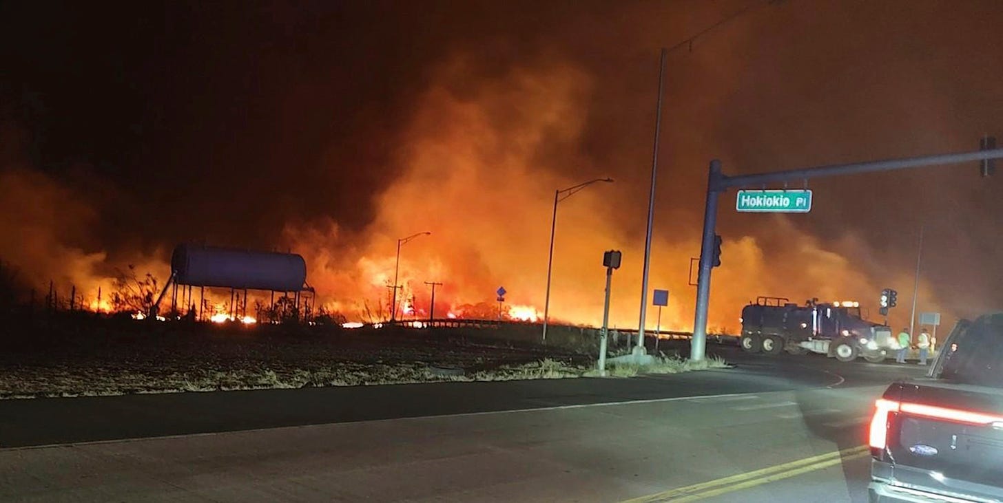 This photo provided by County of Maui shows fire and smoke filling the sky from wildfires in Maui, Hawaii on Tuesday.