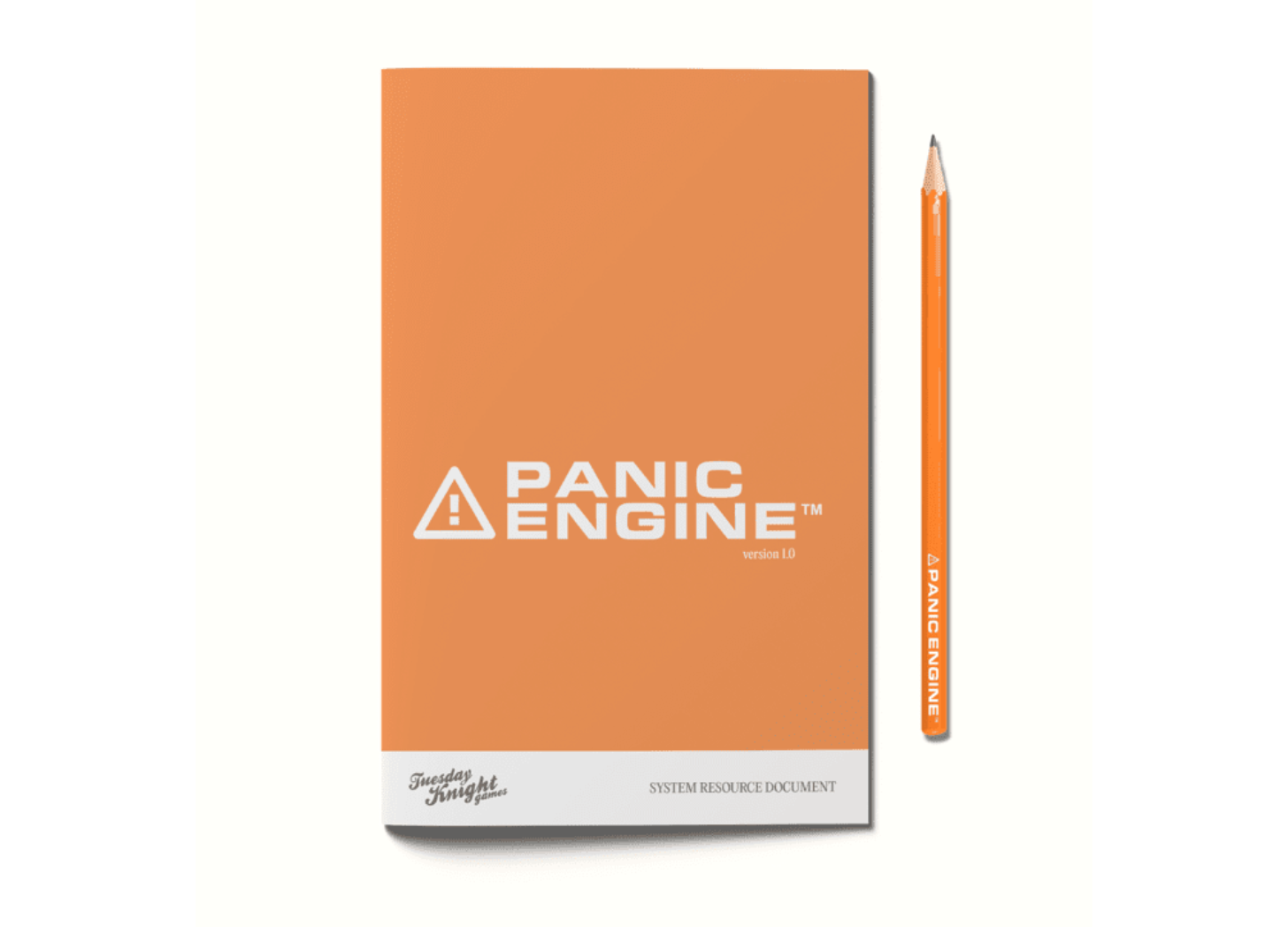 A mock-up of an orange Panic Engine SRD zine, with a pencil next to it.