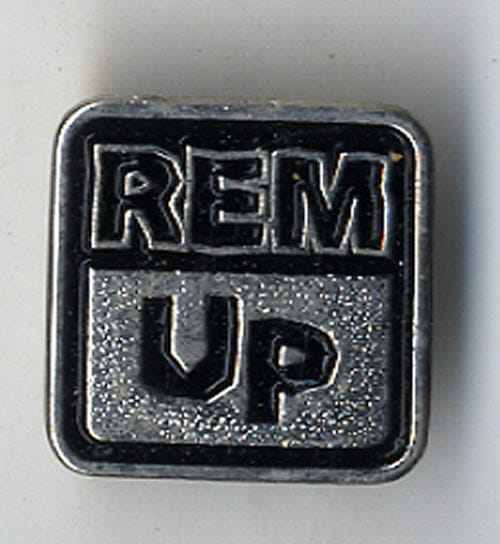 REM 'Up' metal badge