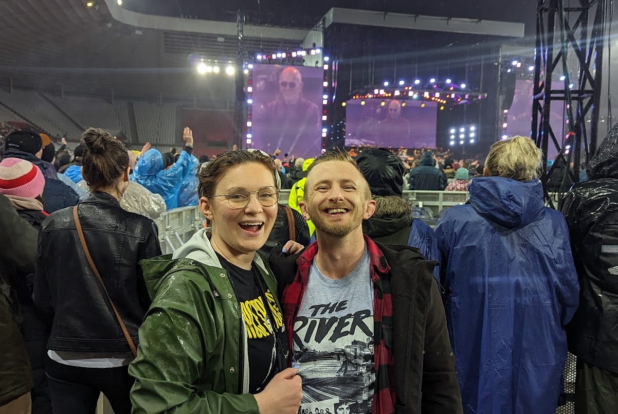 Ellen and Craig smiling in the busy crowd at Bruce Springsteen in Sunderland 