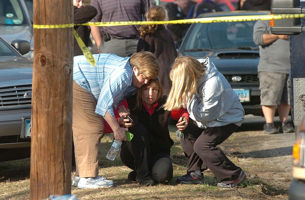 People grieving in 2012.