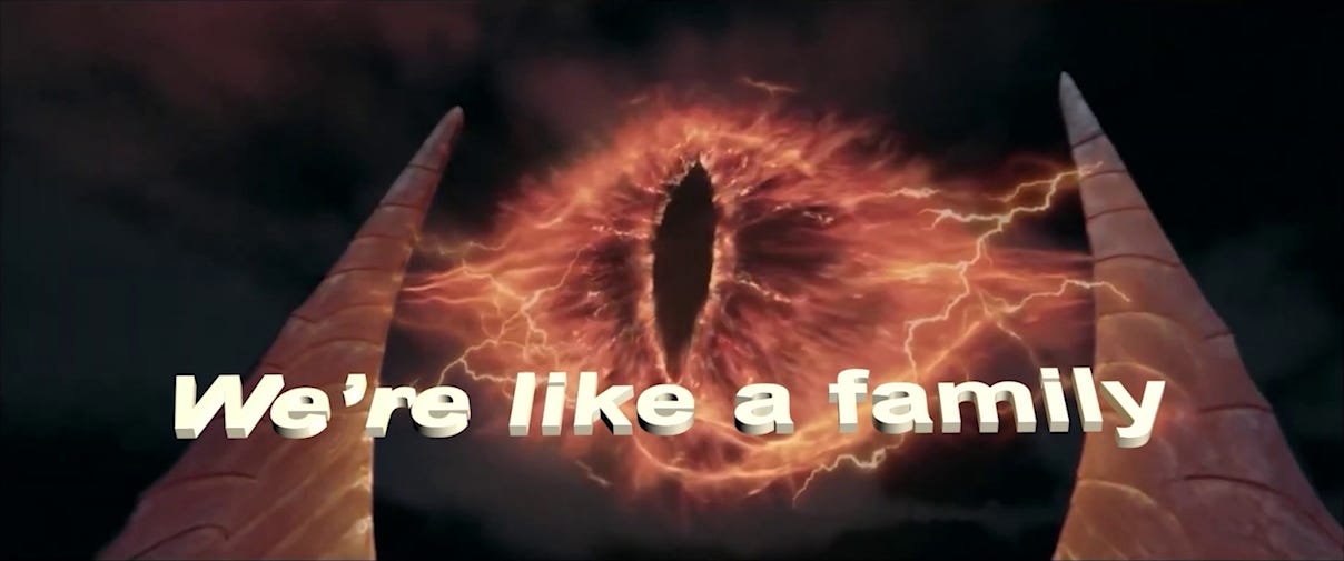 Sauron's flaming red eye atop the tower Barad-dûr with text reading "We're like a family"