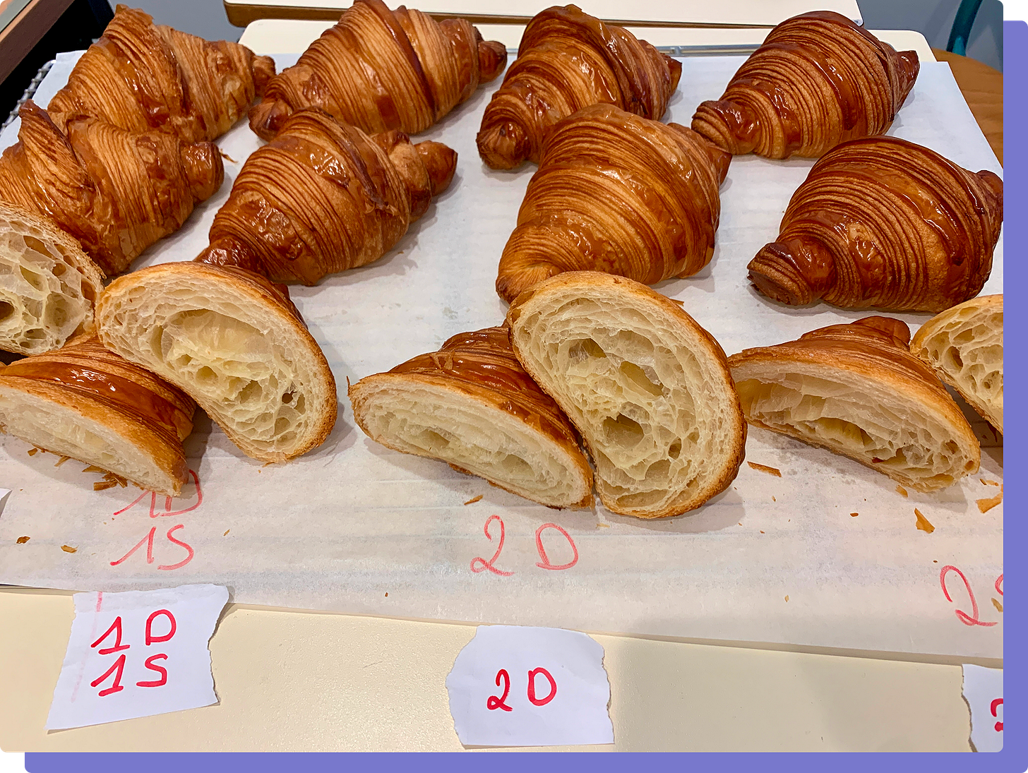 Photo of a tray of labeled croissants