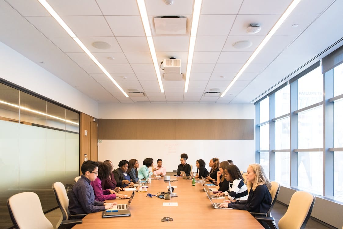 Free A multicultural team brainstorming and collaborating during a business meeting. Stock Photo