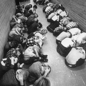 Duck And Cover Drill In School Classroom by Bettmann