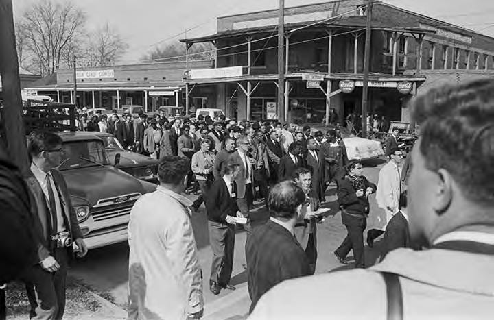 Civil rights marchers walking toward the Edmund Pettus Bridge in Selma,  Alabama, on Turnaround Tuesday. - Alabama Media Group Collection - Alabama  Department of Archives and History