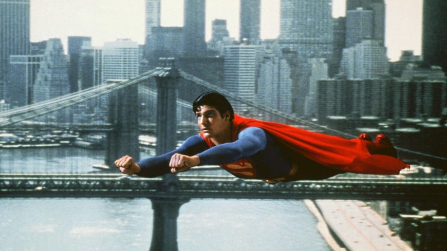 A person in a superhero garment flying over a bridge

Description automatically generated