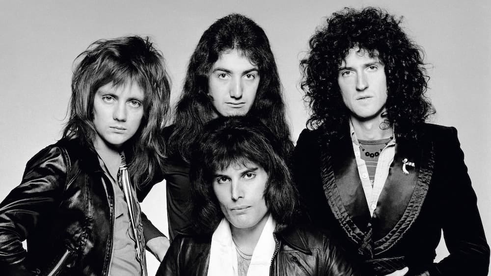 A black and white photo of the rock group Queen