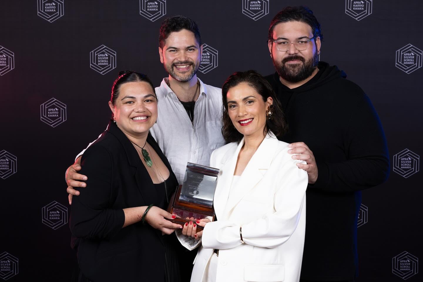 Photo of Anna Coddington and co-writers accepting the Silver Scroll award.