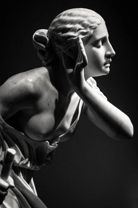 A marble statue, hand cupping her ear, she listens for the truths. She teaches me how to hear them.