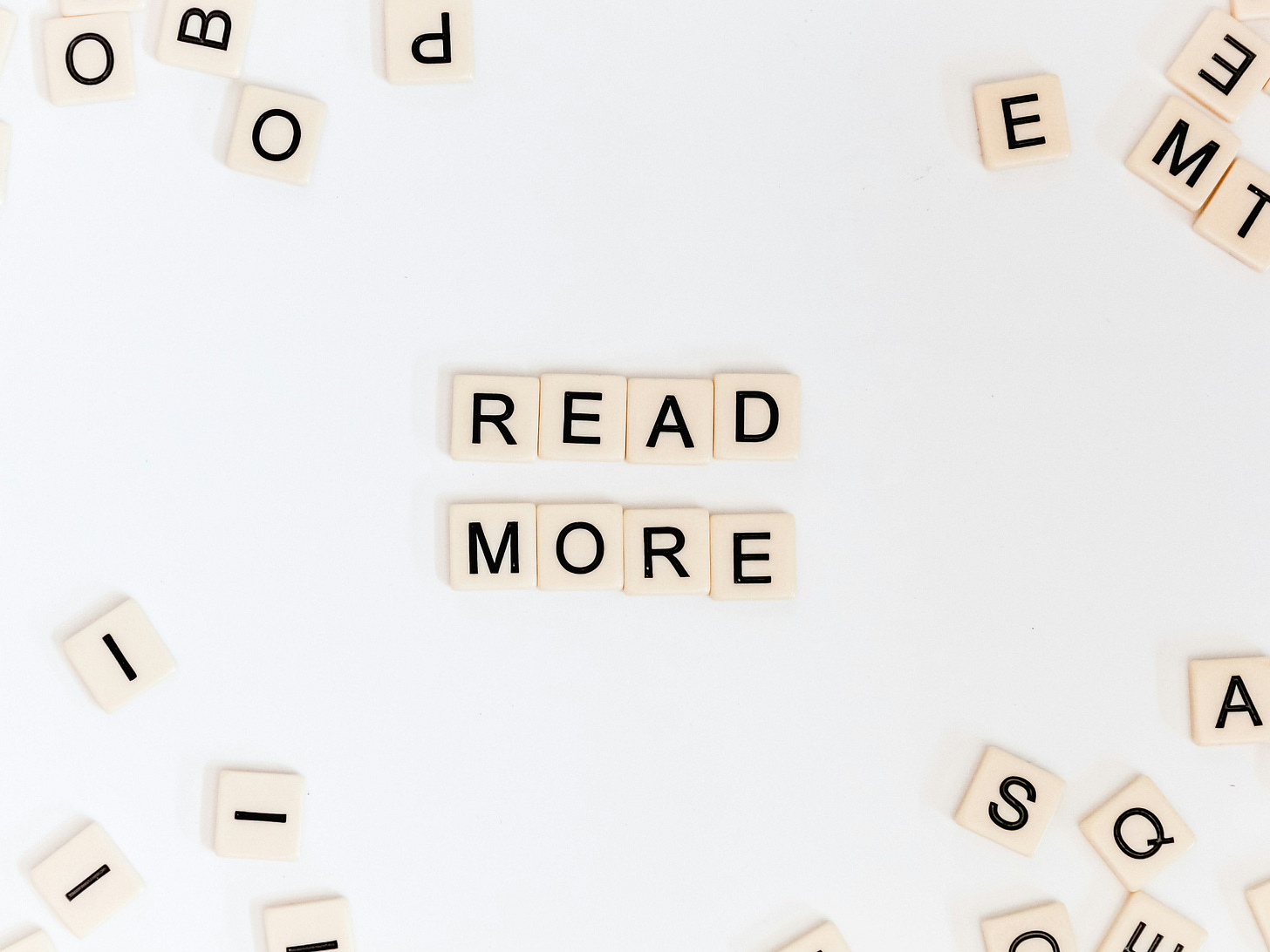 Letter tiles spelling out a message saying "Read More" Letter tiles spelling out a message saying "Read More"