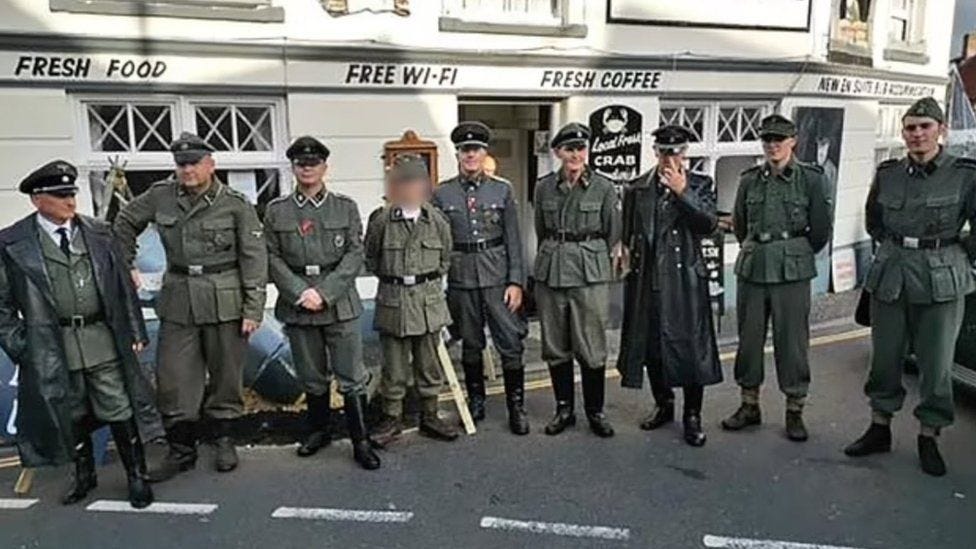 Men wearing SS uniforms at a 1940s celebration in Sheringham, Norfolk