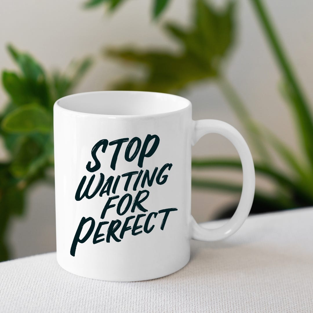 Picture of a white mug and a with the text "Stop Waiting for Perfect"