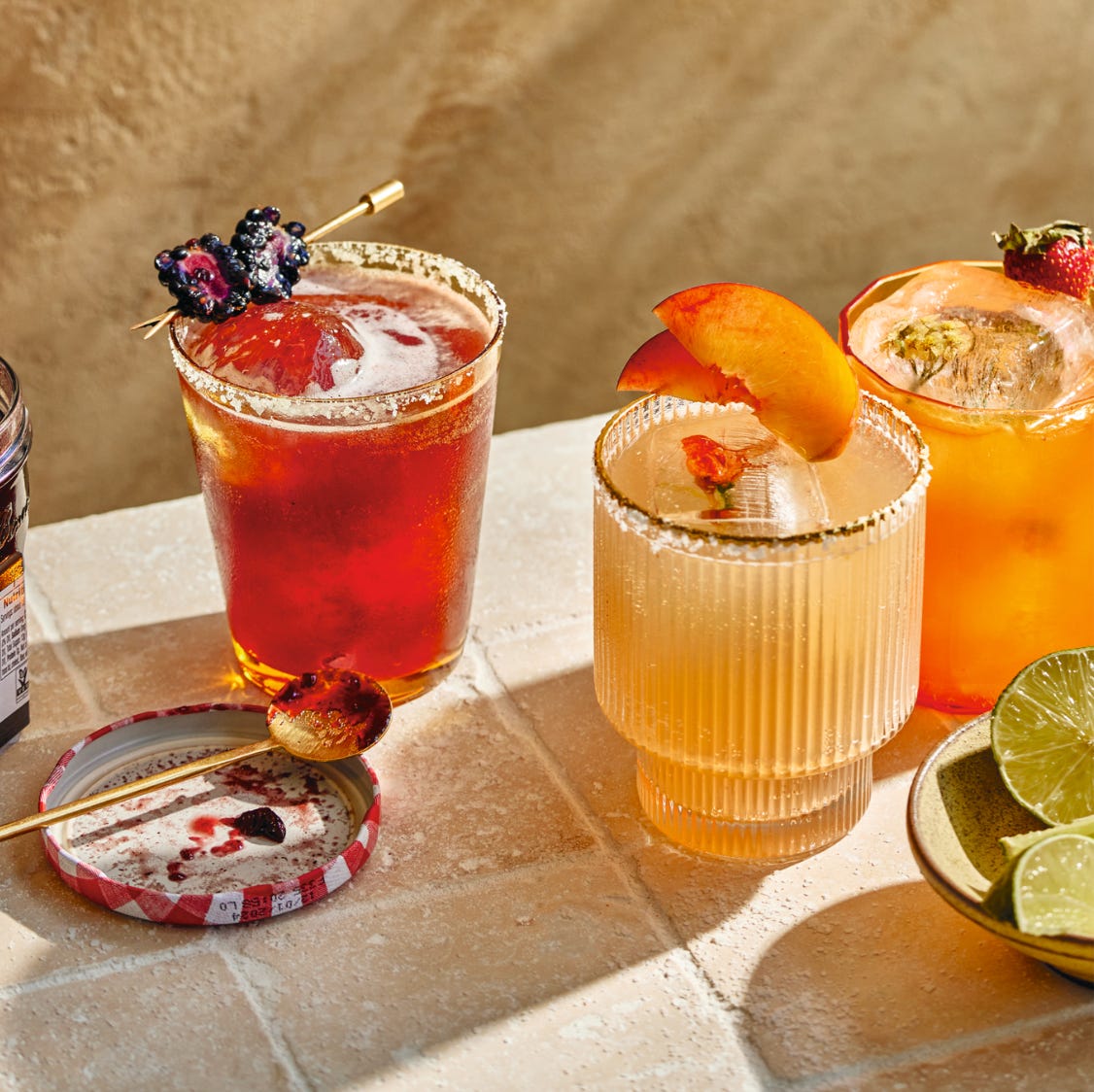 photo of assorted flavors of margaritas, each garnished with fruit