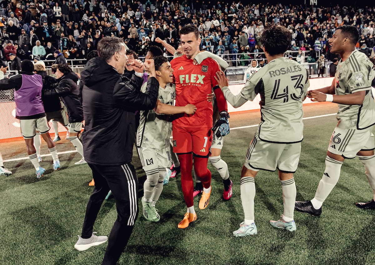 Players mob Eldin Jakupovic in celebration after LAFC's shootout win over Monterey Bay FC in the U.S. Open Cup.
