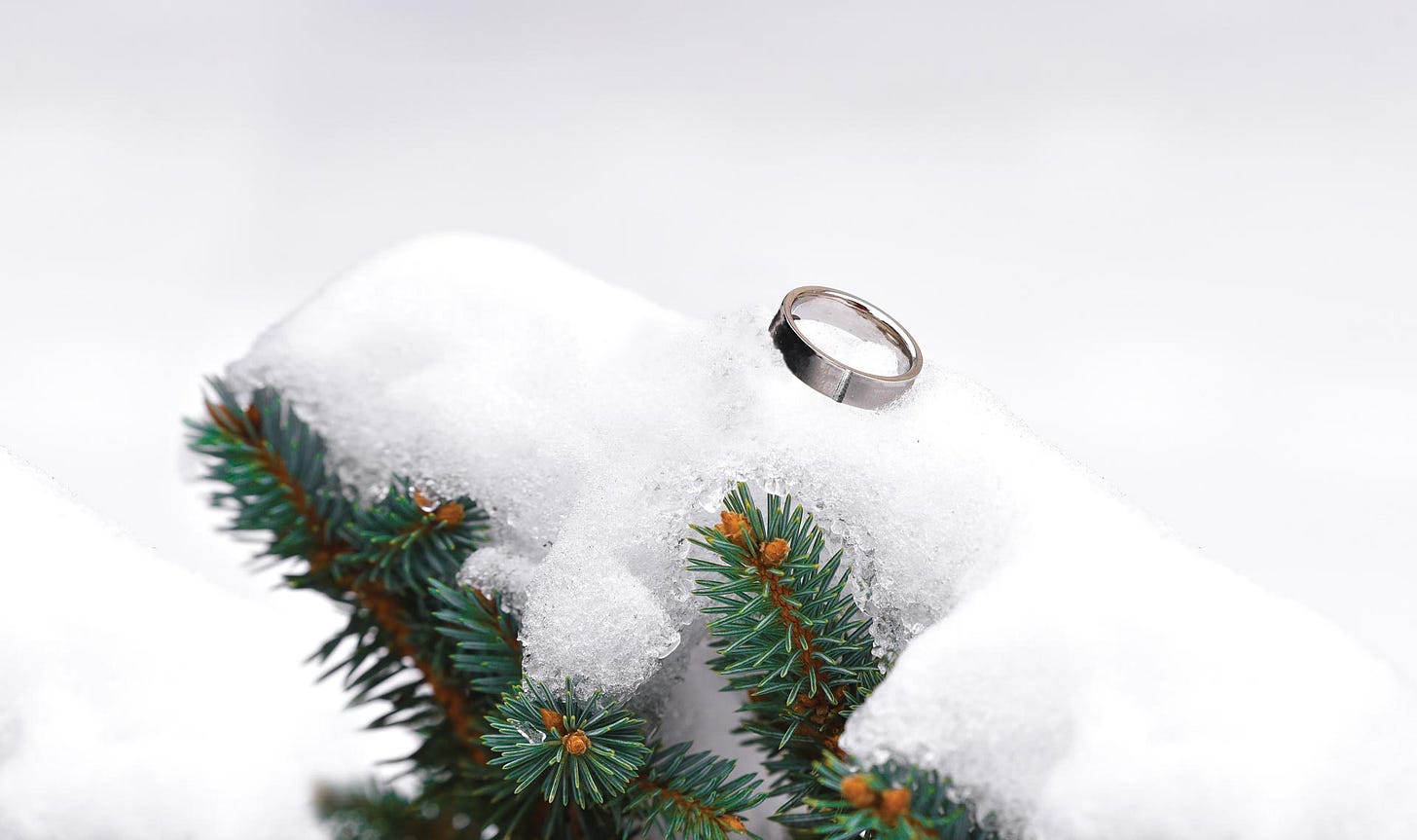 Broken wedding ring soldered together, indicating getting married again