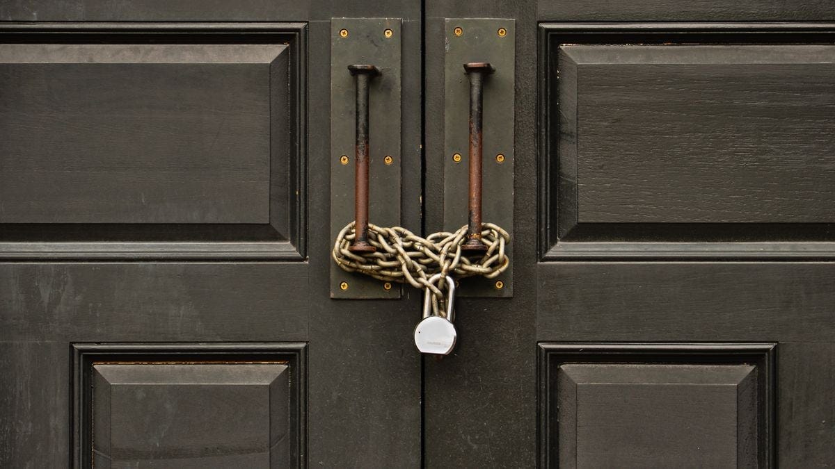 padlocked wooden door