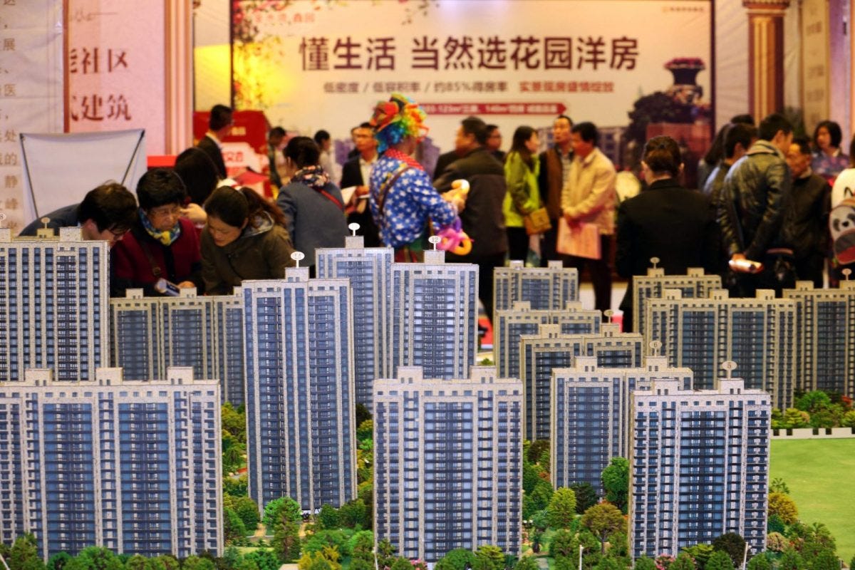 Buyers check out offerings at a residential property display during a real estate fair in Nantong city, east China's Jiangsu province.Photo: AFP