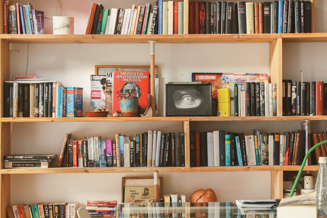 Free Books in Shelf Inside Room Stock Photo