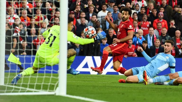 Mohamed Salah scores past Ederson after beating three Man City defenders to put Liverpool 2-1 up