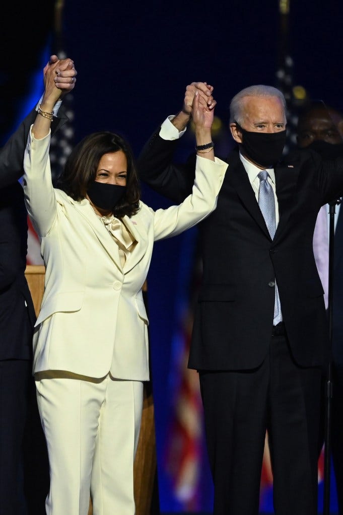 US President-elect Joe Biden and Vice President-elect Kamala Harris stand onstage after delivering remarks in Wilmington, Delaware, on November 7, 2020.