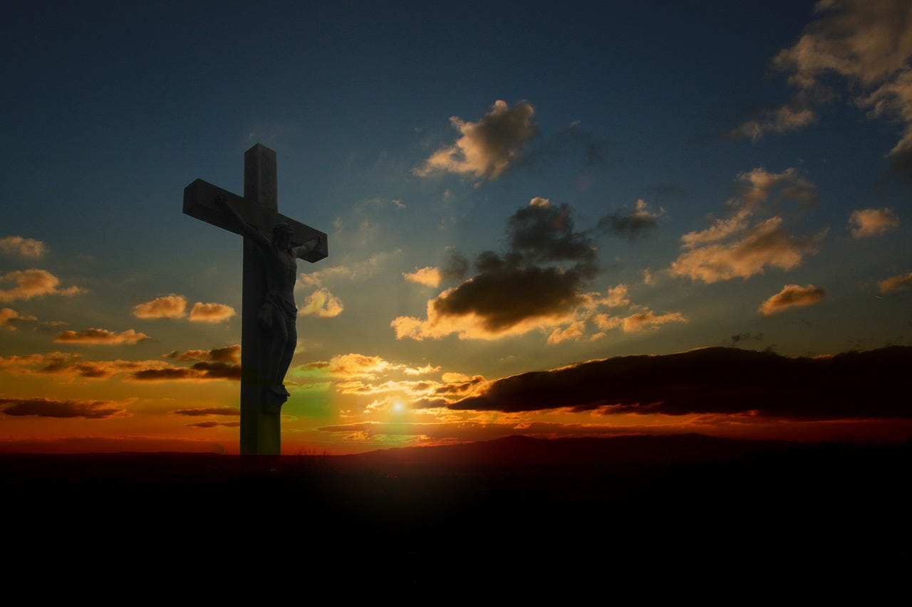 A cross with Jesus crucified on it