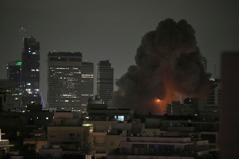 An explosion is seen after an Iranian missile struck Tel Aviv, occupied Palestine, Monday, June 16, 2025 (AP) An explosion is seen after an Iranian missile struck Tel Aviv, occupied Palestine, Monday, June 16, 2025 (AP)