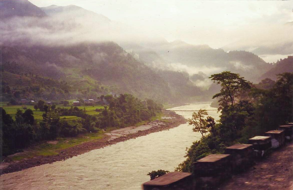 river flowing near mountains
